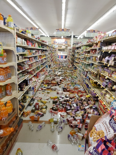 Products in a store fallen into aisle after earthquake